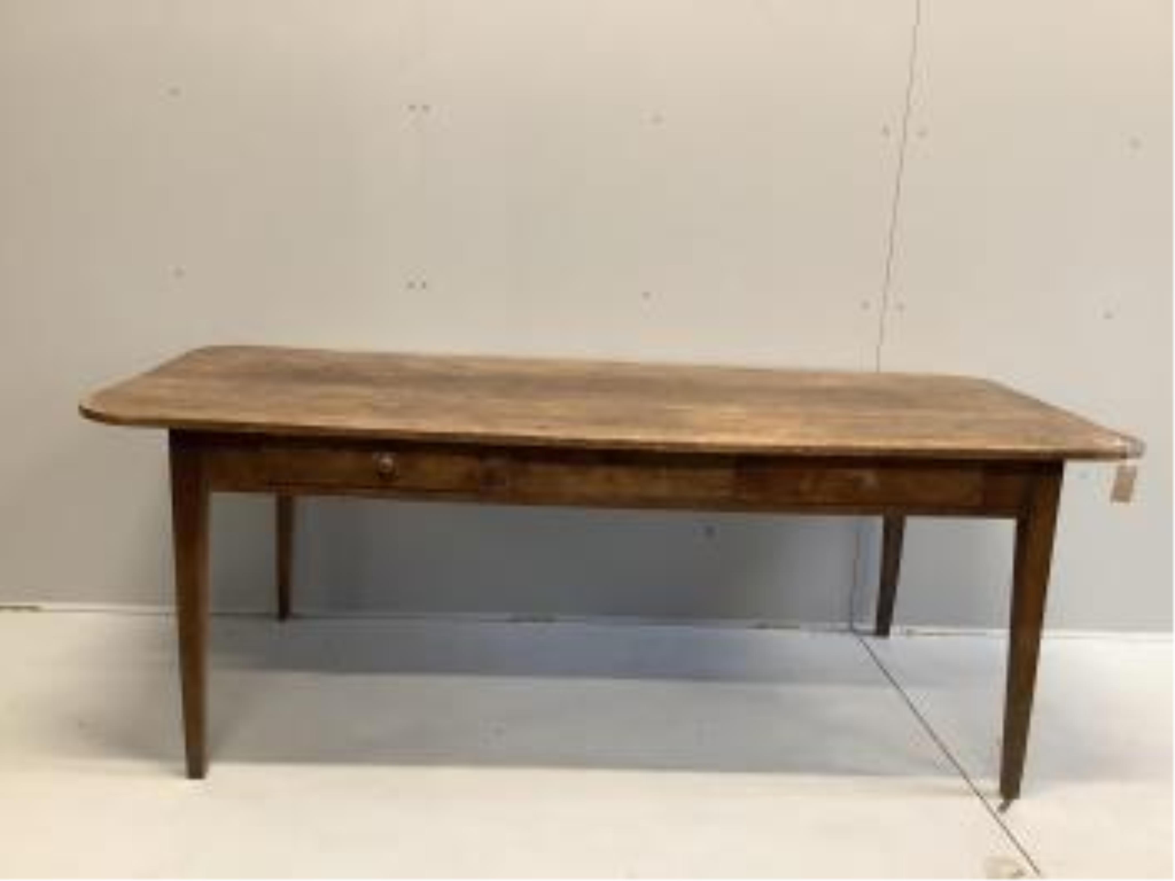 A 19th century French rectangular fruitwood kitchen table, width 200cm, depth 88cm, height 72cm. Condition - fair for age, old worming holes that have been treated